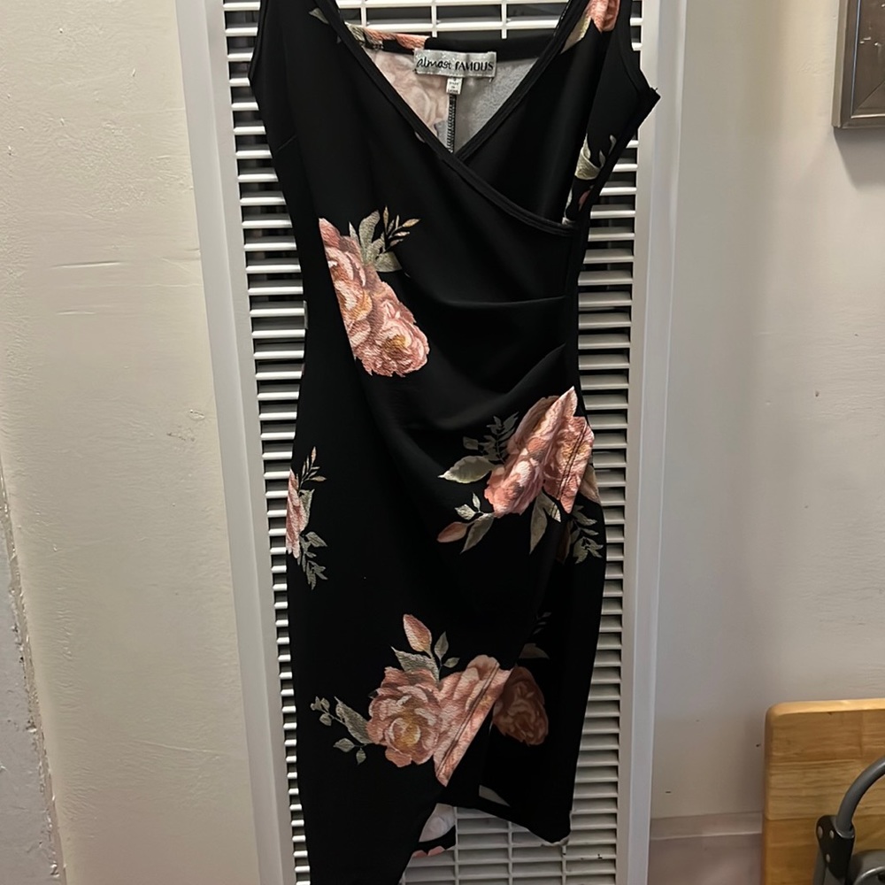Little black floral dress with an angle on the bottom